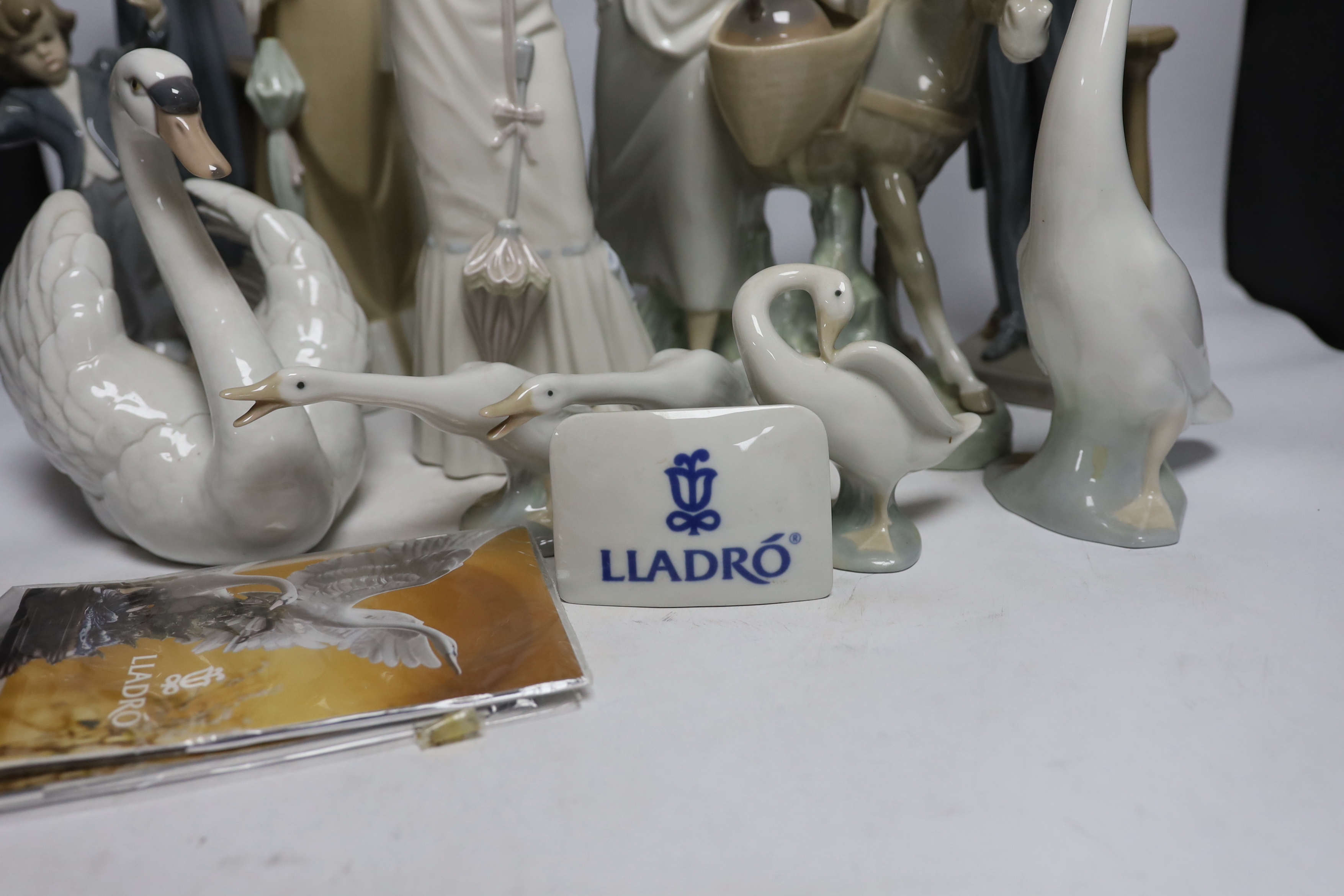 A collection of various Lladro figures including composers, swans, etc. tallest 50cm